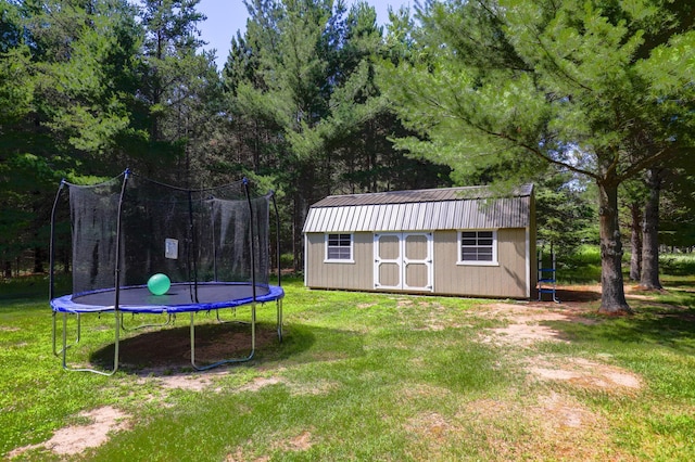 32433 Cedar St, Breezy Point, MN 56472 - view of green lawn with a trampoline and a shed