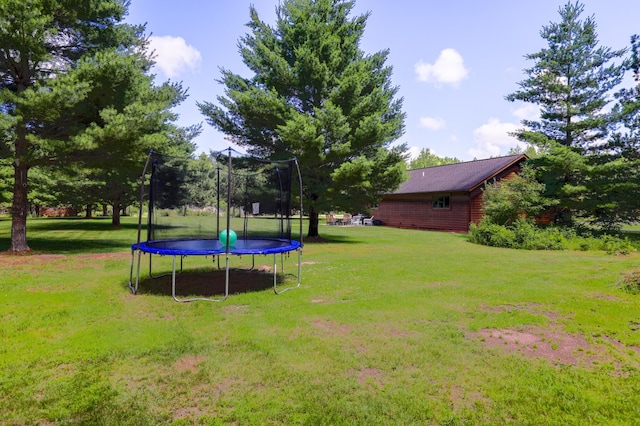 32433 Cedar St, Breezy Point, MN 56472 - view of green lawn featuring a trampoline