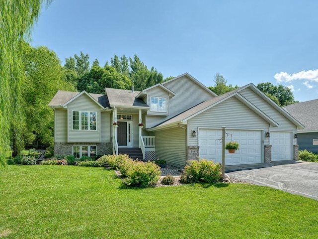 1483 Woods Creek Dr, Delano, MN 55328 - split level home featuring an attached garage, asphalt driveway, a front yard, and brick siding