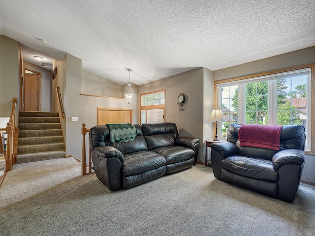 1483 Woods Creek Dr, Delano, MN 55328 - living area with carpet floors, plenty of natural light, stairway, and a textured ceiling