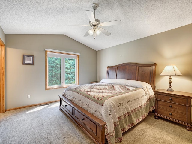 1483 Woods Creek Dr, Delano, MN 55328 - bedroom featuring light colored carpet, vaulted ceiling, a ceiling fan, and a textured ceiling