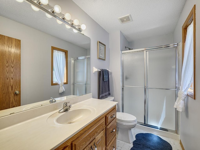 1483 Woods Creek Dr, Delano, MN 55328 - full bath featuring vanity, a shower stall, and a textured ceiling