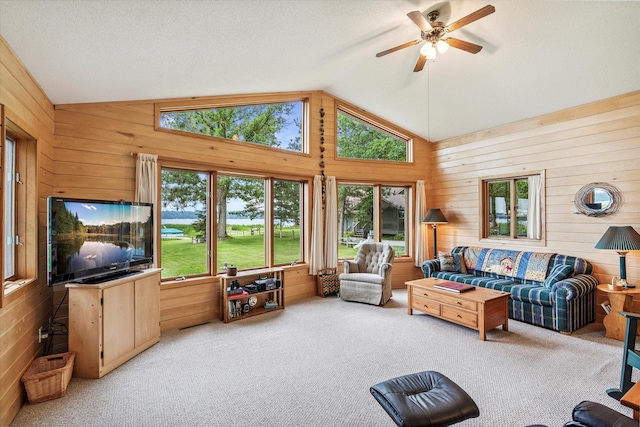 11959 Northgate Ln, Fifty Lakes, MN 56442 - carpeted living room with wooden walls, vaulted ceiling, plenty of natural light, and ceiling fan