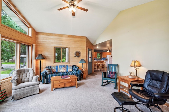 11959 Northgate Ln, Fifty Lakes, MN 56442 - living area featuring wooden walls, ceiling fan, carpet flooring, and high vaulted ceiling
