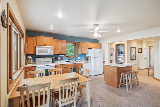 11959 Northgate Ln, Fifty Lakes, MN 56442 - kitchen featuring white appliances, a center island, recessed lighting, ceiling fan, and light countertops
