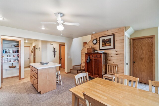 11959 Northgate Ln, Fifty Lakes, MN 56442 - dining area with ceiling fan, light colored carpet, recessed lighting, and wooden walls