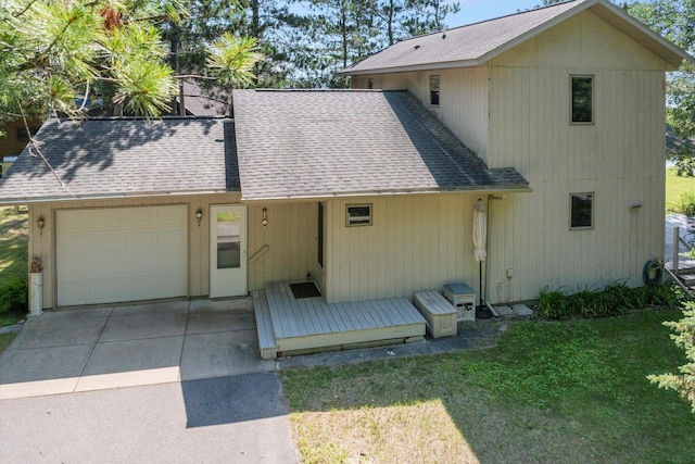 11959 Northgate Ln, Fifty Lakes, MN 56442 - view of front of property featuring a shingled roof, an attached garage, driveway, and a front yard