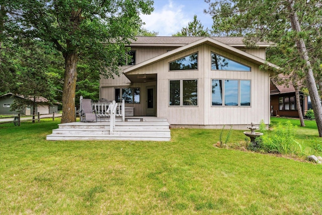 11959 Northgate Ln, Fifty Lakes, MN 56442 - back of house with a lawn, a wooden deck, and a shingled roof