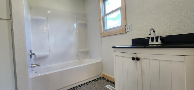 1402 3rd St NE, Staples, MN 56479 - full bath featuring vanity, shower / tub combination, and tile patterned floors
