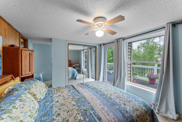 17053 490th St, Shamrock Twp, MN 55760 - bedroom featuring a textured ceiling, a ceiling fan, and a closet