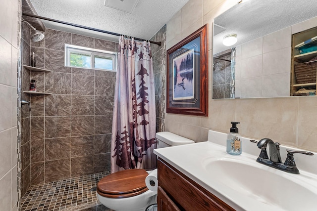 17053 490th St, Shamrock Twp, MN 55760 - bathroom featuring a textured ceiling, tile walls, vanity, a tile shower, and tasteful backsplash