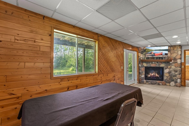 17053 490th St, Shamrock Twp, MN 55760 - tiled bedroom with wooden walls, a drop ceiling, a fireplace, and billiards