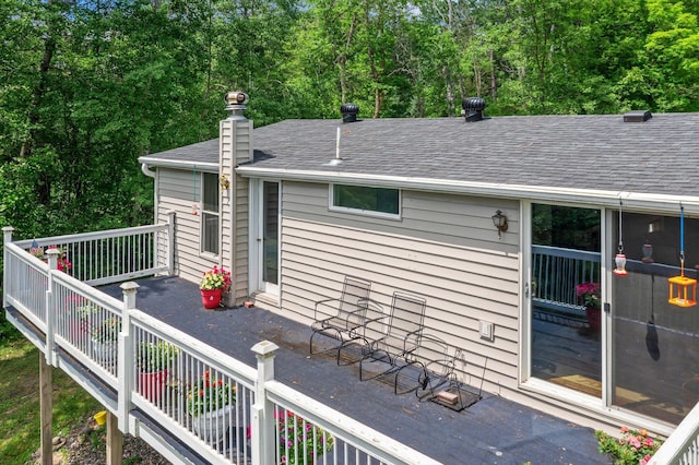 17053 490th St, Shamrock Twp, MN 55760 - view of side of property with a shingled roof and a chimney