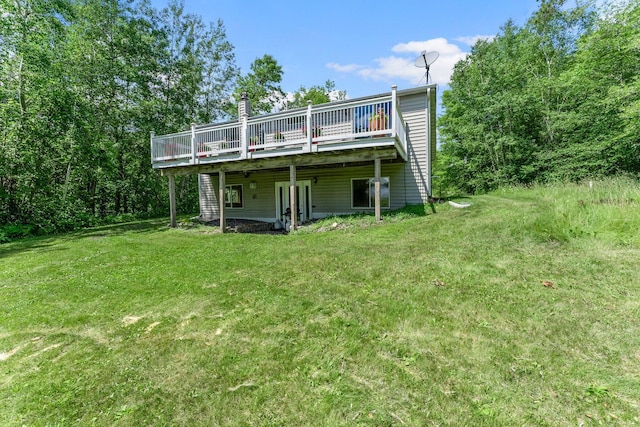 17053 490th St, Shamrock Twp, MN 55760 - back of property with a deck and a yard