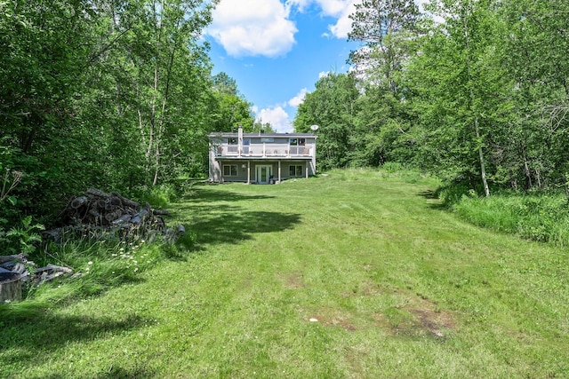17053 490th St, Shamrock Twp, MN 55760 - view of grassy yard featuring a deck