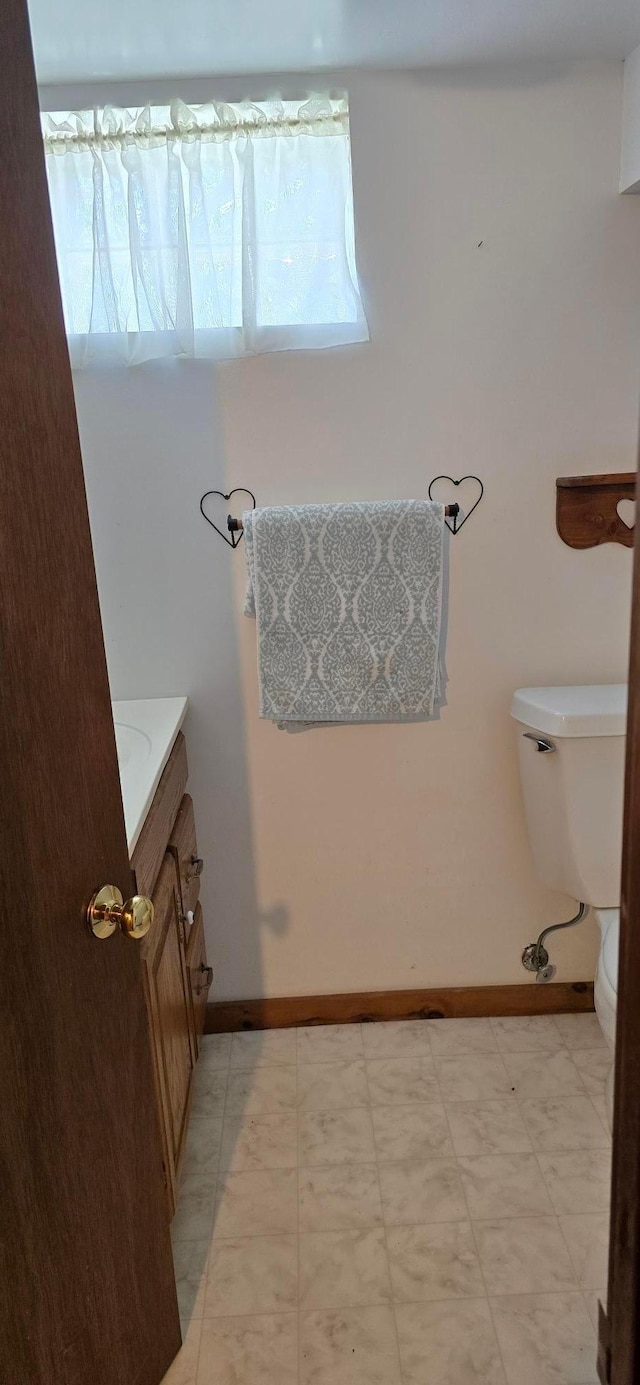 309 5th St SW, Austin, MN 55912 - bathroom with vanity and tile patterned floors