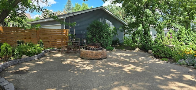 309 5th St SW, Austin, MN 55912 - view of patio / terrace with a fire pit