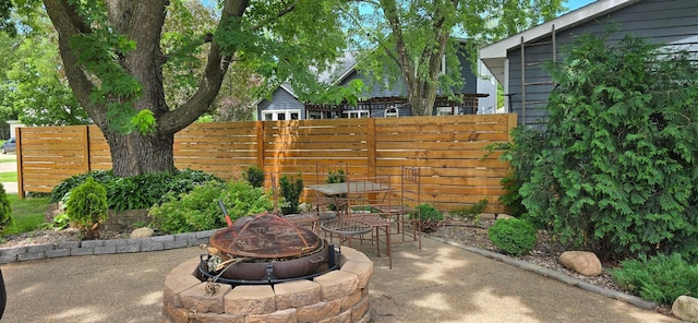 309 5th St SW, Austin, MN 55912 - view of patio / terrace with an outdoor fire pit