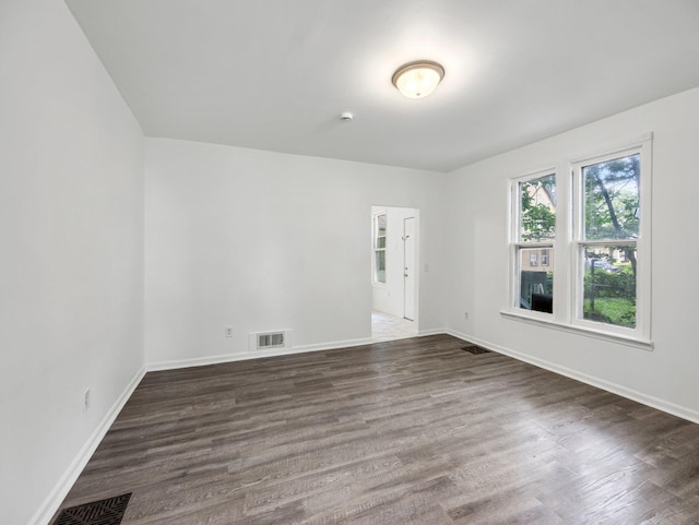 587 Elfelt St, Saint Paul, MN 55103 - empty room with dark wood-style flooring and baseboards