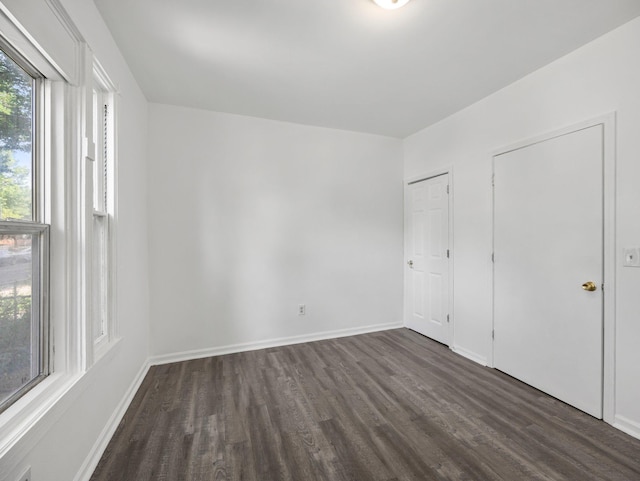 587 Elfelt St, Saint Paul, MN 55103 - unfurnished bedroom with dark wood finished floors and baseboards