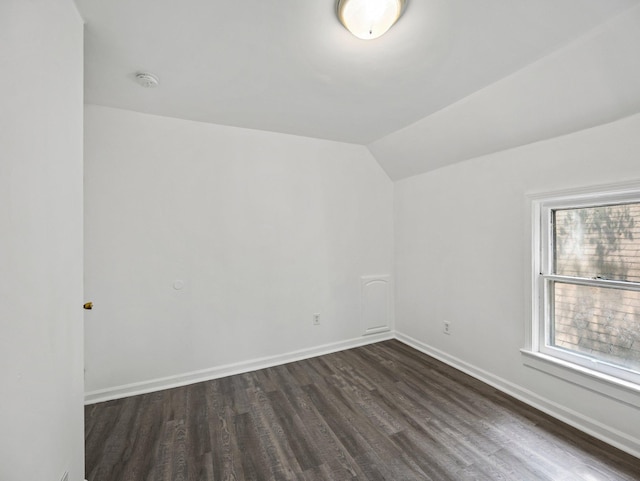 587 Elfelt St, Saint Paul, MN 55103 - unfurnished room featuring a smoke detector, dark wood finished floors, and lofted ceiling
