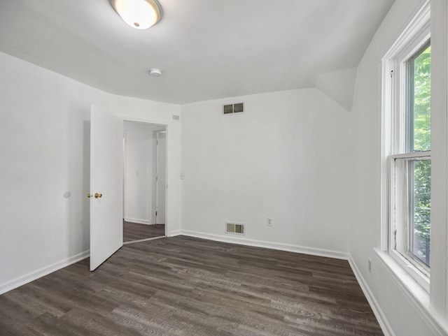 587 Elfelt St, Saint Paul, MN 55103 - empty room with dark wood-type flooring and a smoke detector