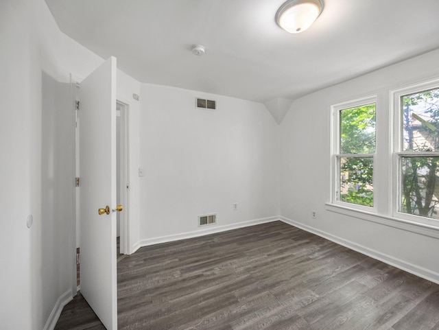 587 Elfelt St, Saint Paul, MN 55103 - empty room with dark wood-type flooring, a smoke detector, and lofted ceiling