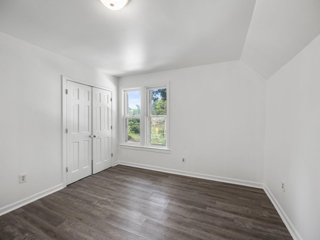 587 Elfelt St, Saint Paul, MN 55103 - unfurnished bedroom with dark wood finished floors and a closet