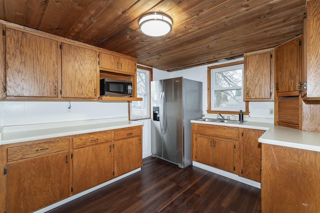 1210 9th St NE, Austin, MN 55912 - kitchen featuring stainless steel fridge with ice dispenser, wooden ceiling, dark wood-type flooring, brown cabinets, and light countertops