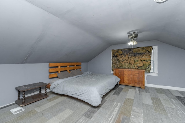 1210 9th St NE, Austin, MN 55912 - carpeted bedroom featuring lofted ceiling