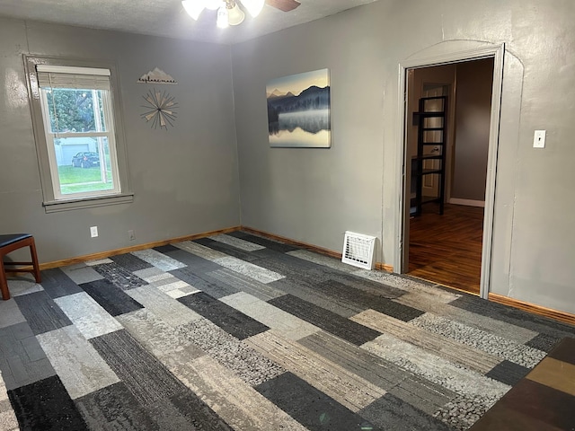 1210 9th St NE, Austin, MN 55912 - empty room featuring ceiling fan and wood finished floors