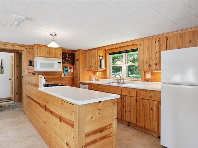 26713 Pelican Beach Rd, Lake Edward Twp, MN 56465 - kitchen featuring white appliances, light countertops, wood walls, hanging light fixtures, and a peninsula