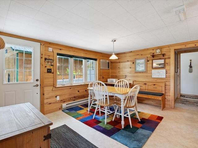 26713 Pelican Beach Rd, Lake Edward Twp, MN 56465 - carpeted dining room with a baseboard heating unit, wood walls, and a wall mounted air conditioner