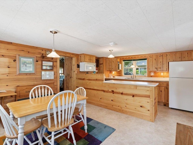 26713 Pelican Beach Rd, Lake Edward Twp, MN 56465 - dining room featuring wooden walls and light carpet
