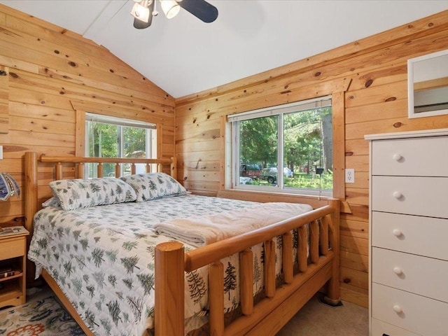 26713 Pelican Beach Rd, Lake Edward Twp, MN 56465 - carpeted bedroom featuring wood walls, vaulted ceiling, and ceiling fan