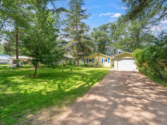 26713 Pelican Beach Rd, Lake Edward Twp, MN 56465 - single story home featuring driveway, an outbuilding, a front lawn, and a detached garage
