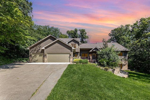 2655 88th Ct W, Northfield, MN 55057 - view of front of home featuring driveway, a garage, a front lawn, and stone siding