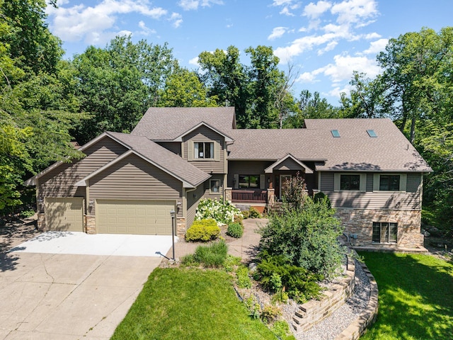 2655 88th Ct W, Northfield, MN 55057 - tri-level home featuring driveway, a garage, stone siding, a front yard, and roof with shingles