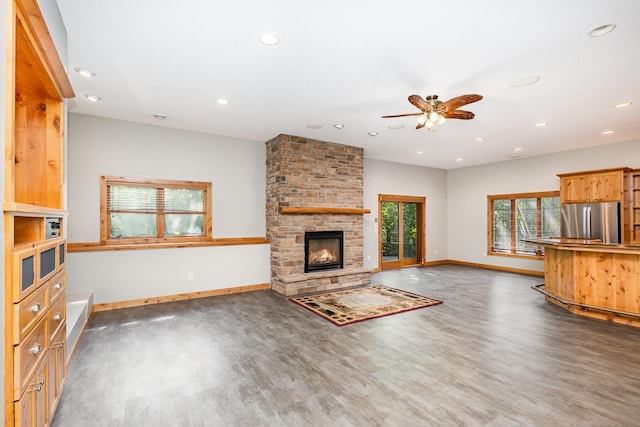 2655 88th Ct W, Northfield, MN 55057 - unfurnished living room with wood finished floors, recessed lighting, a ceiling fan, and a large fireplace