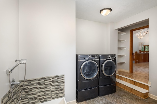 2655 88th Ct W, Northfield, MN 55057 - laundry area with washer and clothes dryer and a chandelier
