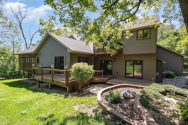 2655 88th Ct W, Northfield, MN 55057 - rear view of house featuring a yard, a deck, a shingled roof, and a sunroom