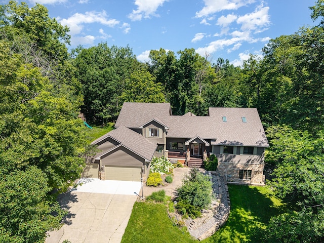 2655 88th Ct W, Northfield, MN 55057 - view of front of home with stone siding, driveway, a front lawn, and an attached garage