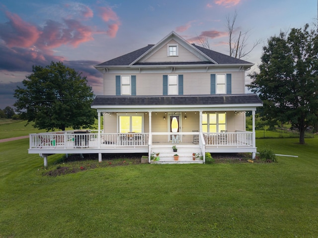 W2741 US Highway 10, Grant Twp, WI 54436 - view of front of property featuring a lawn, a shingled roof, and a porch