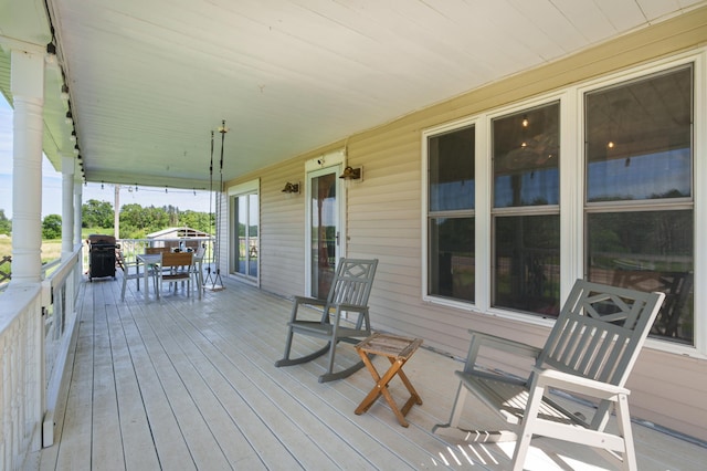W2741 US Highway 10, Grant Twp, WI 54436 - porch featuring grilling area and outdoor dining area