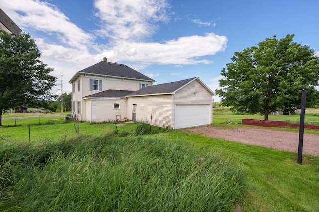 W2741 US Highway 10, Grant Twp, WI 54436 - view of property exterior featuring dirt driveway and an attached garage