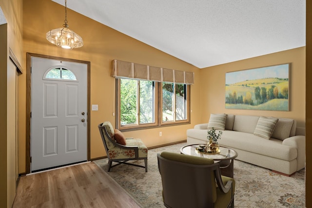 1010 Zanzibar Ln N, Plymouth, MN 55447 - entrance foyer with lofted ceiling, a chandelier, and light wood-style floors