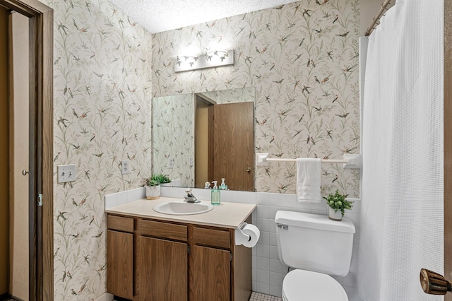 1010 Zanzibar Ln N, Plymouth, MN 55447 - bathroom featuring wallpapered walls, vanity, and a textured ceiling