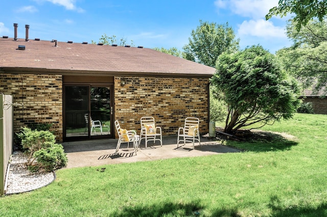 1010 Zanzibar Ln N, Plymouth, MN 55447 - back of property featuring brick siding, a patio area, a lawn, and a shingled roof