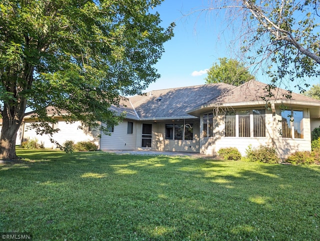 506 6th St SE, Little Falls, MN 56345 - rear view of property featuring a lawn and roof with shingles