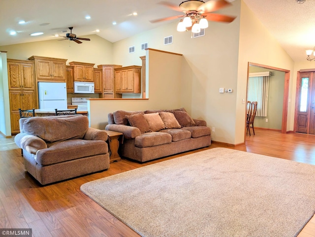 506 6th St SE, Little Falls, MN 56345 - living area with ceiling fan, high vaulted ceiling, and light wood finished floors